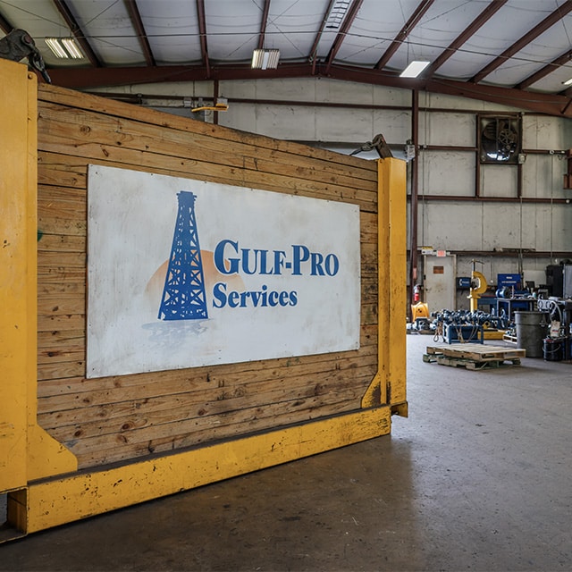 Gulf-Pro Services banner with logo inside Houma facility